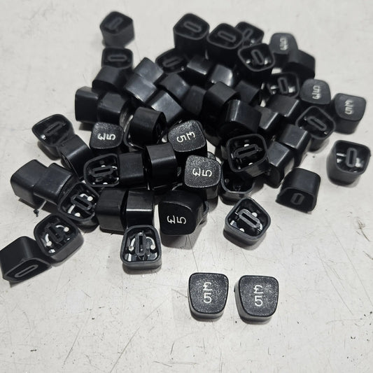 Loose number 5 keytops for Godrej typewriters arranged together, typing machine spare parts for servicing projects