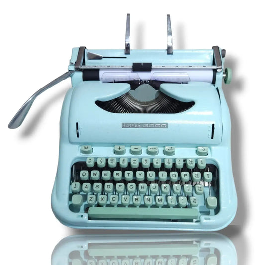 Original mint green Hermes 3000 manual typewriter by RR Typewriter Mart, iconic Swiss typing machine