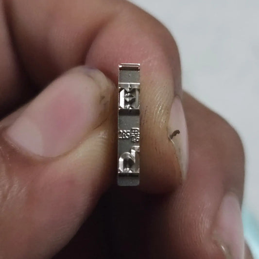 Close-up of English Typewriter Long Motion Typeface H replacement slug for manual typewriter repair and typing machine servicing
