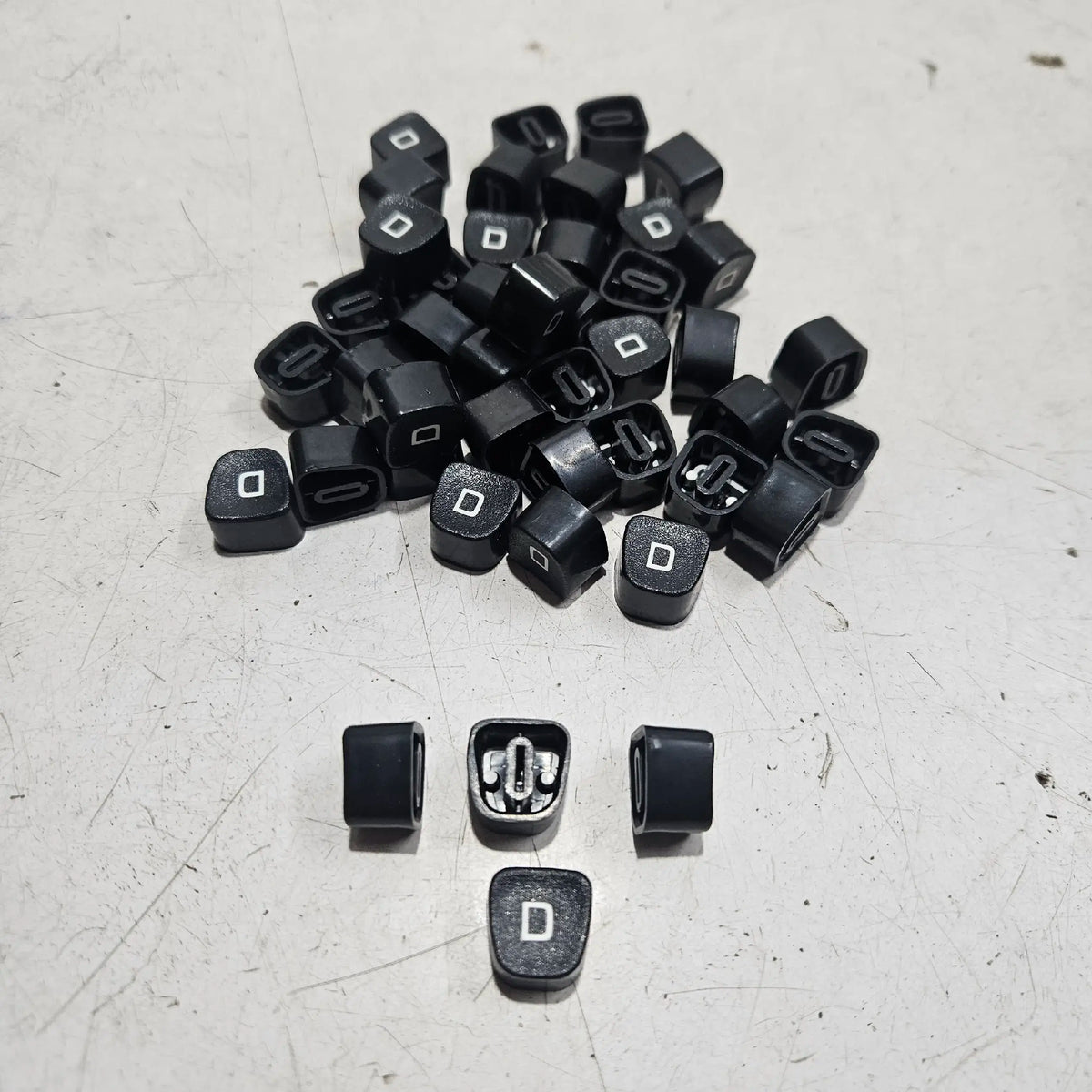Loose D keytops for Godrej typewriters arranged together, typewriter spare parts from RR Typewriter Mart collection