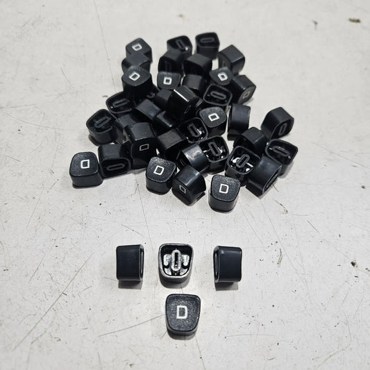 Loose D keytops for Godrej typewriters arranged together, typewriter spare parts from RR Typewriter Mart collection