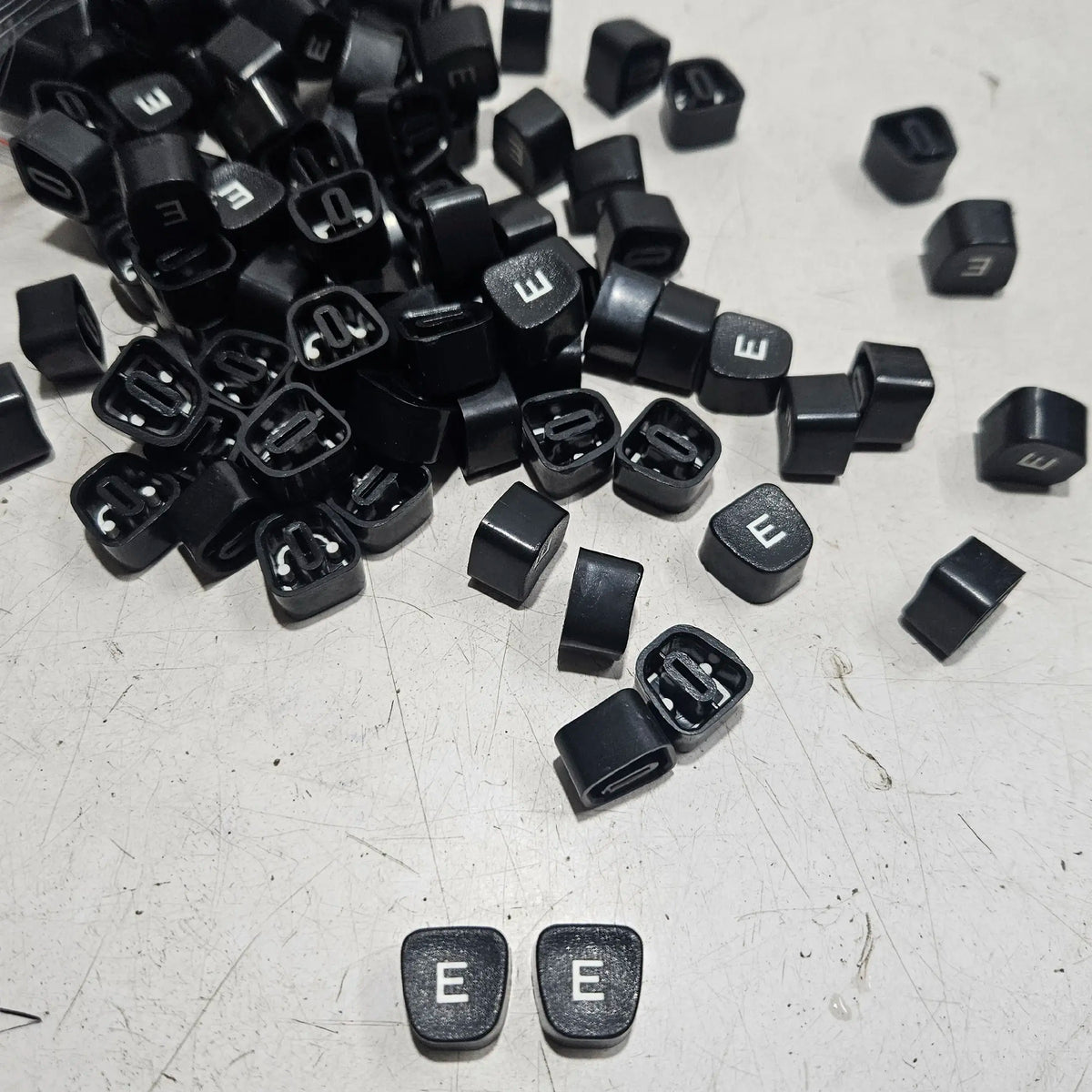 Black Godrej English E typewriter loose keytops for typewriter repair, restoration and typing machine parts