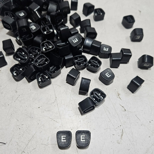 Black Godrej English E typewriter loose keytops for typewriter repair, restoration and typing machine parts
