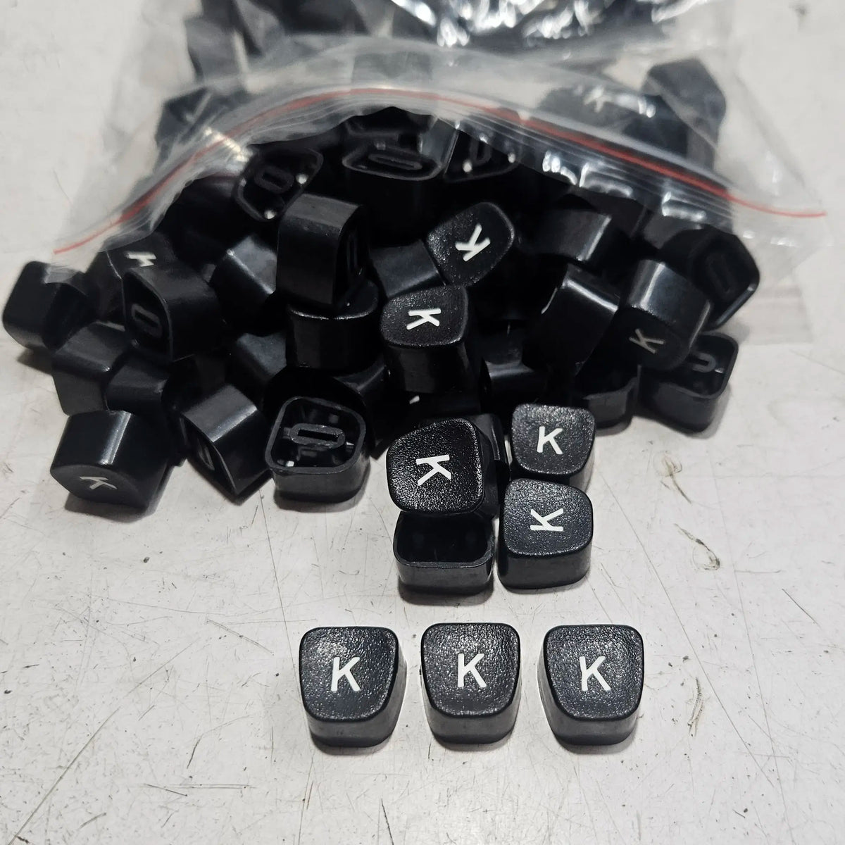 Black Godrej English K typewriter loose keytops for manual typewriter repair, restoration and typing machine spare parts