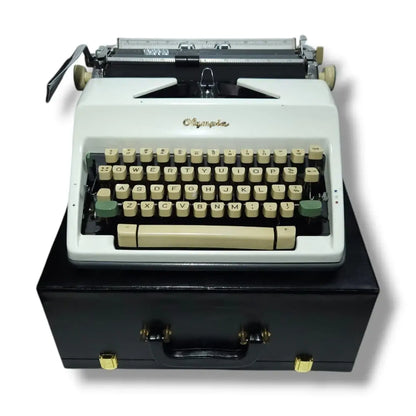 Ivory white Olympia typewriter on black case, manual English typing machine at RR Typewriter Mart store