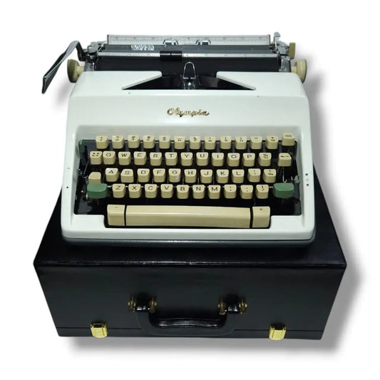 Ivory white Olympia typewriter on black case, manual English typing machine at RR Typewriter Mart store