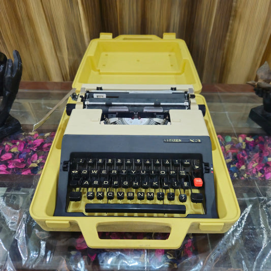 Citizen X3 portable English typewriter with original box on display