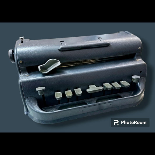 Front angled view of Perkins Braille Typewriter, manual braille typing machine by RR Typewriter Mart with restored finish