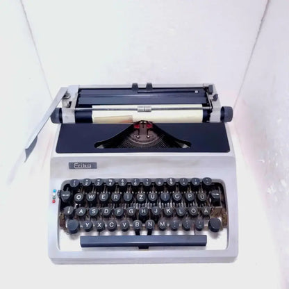 Regal Erika portable typewriter with vintage German mechanical keyboard and retro writing design