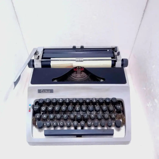 Regal Erika portable typewriter with vintage German mechanical keyboard and retro writing design