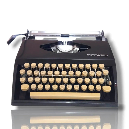 Front view of Adler Tippa S portable typewriter with beige keys and black body