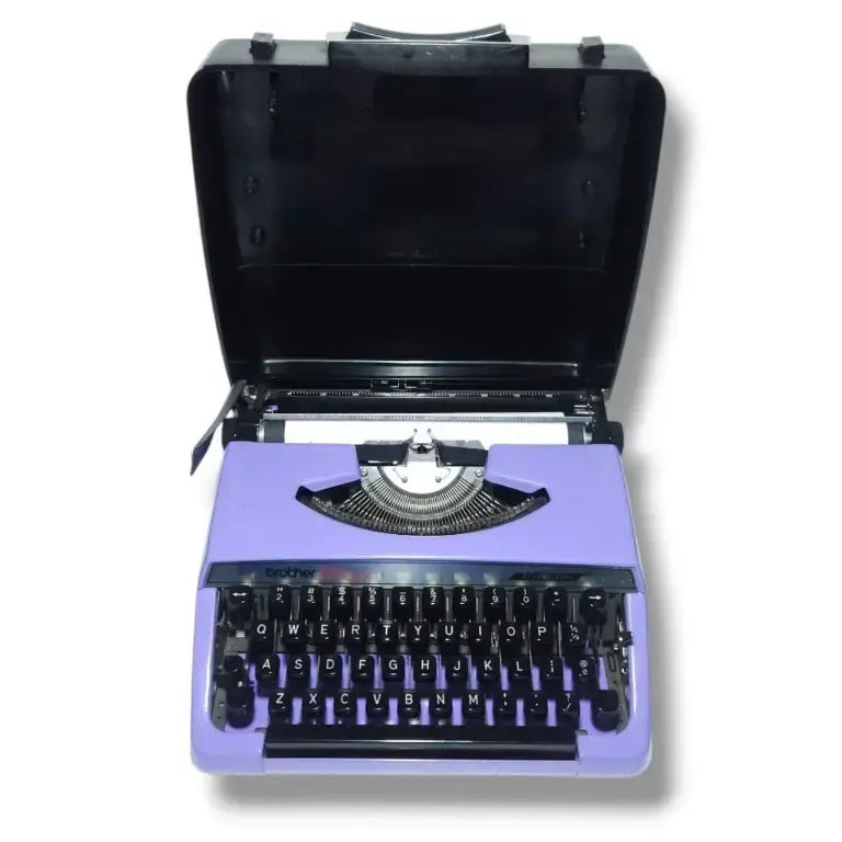 Brother Charger 11 vintage mauve portable typewriter with original carry case open
