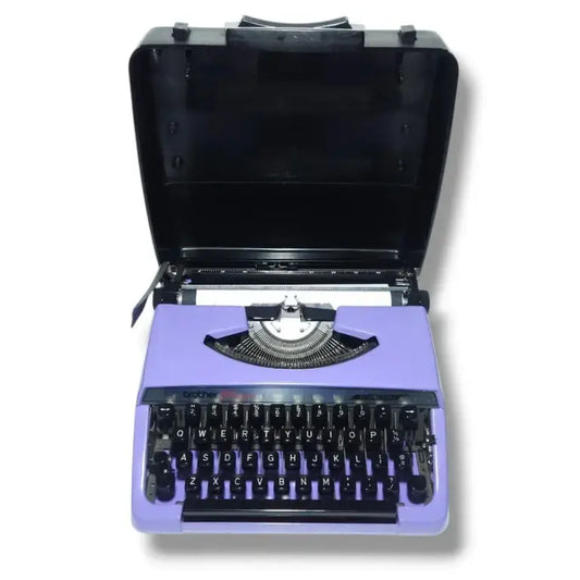Brother Charger 11 vintage mauve portable typewriter with original carry case open