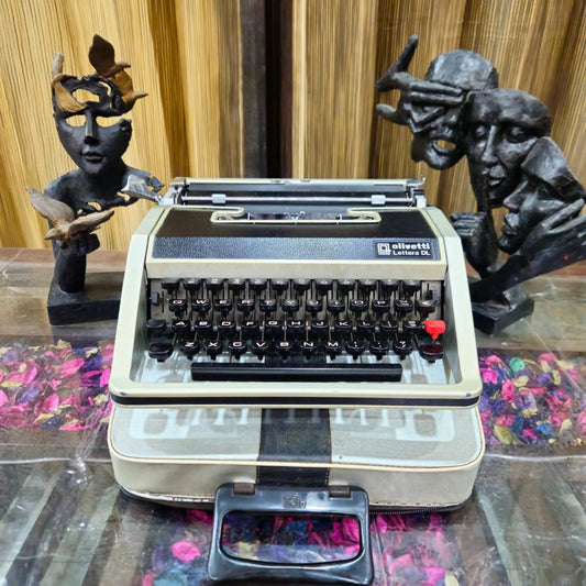Front view of Olivetti typewriter with leather body and English keys, portable classic by RR Typewriter Mart