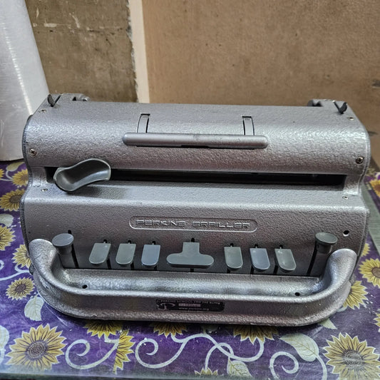 Perkins Braille Typewriter front view in silver finish, manual braille typing machine from RR Typewriter Mart
