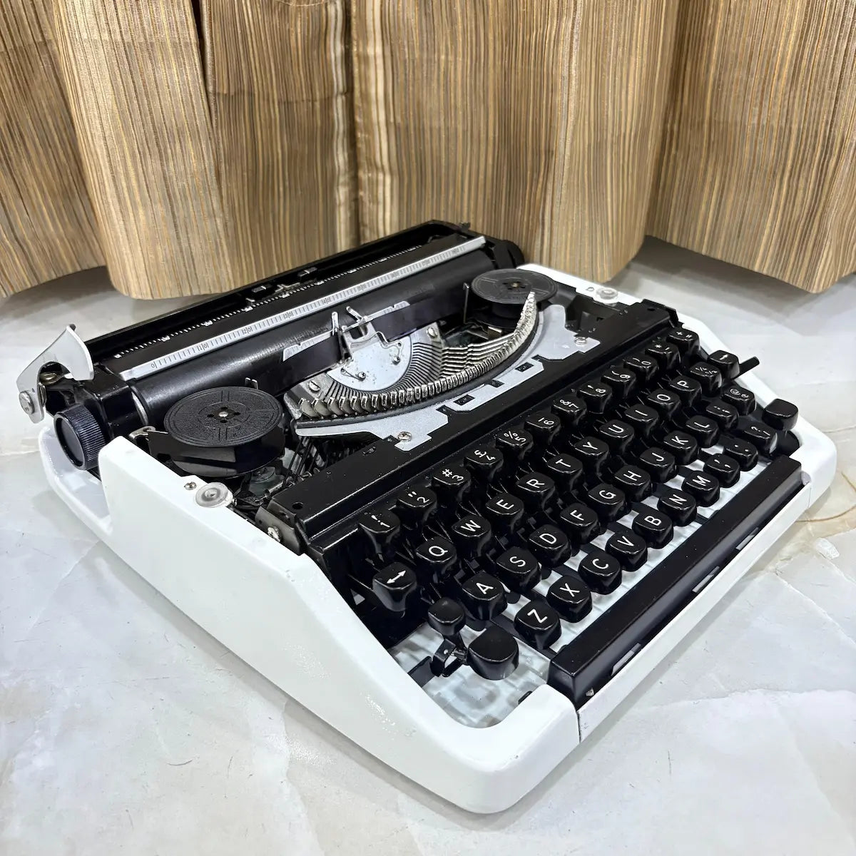 Pearl White Brother Deluxe 220 typewriter, classic QWERTY mechanical typewriter available at RR Typewriter Mart in Delhi, India
