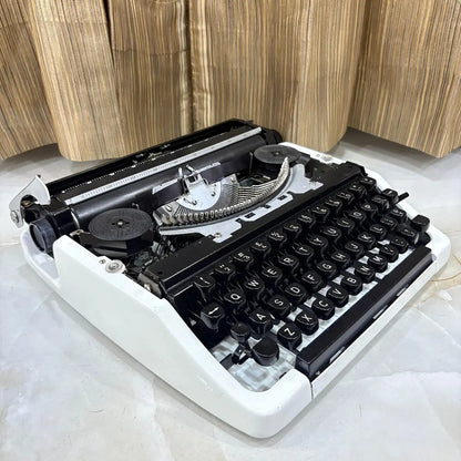 Pearl White Brother Deluxe 220 typewriter, classic QWERTY mechanical typewriter available at RR Typewriter Mart in Delhi, India