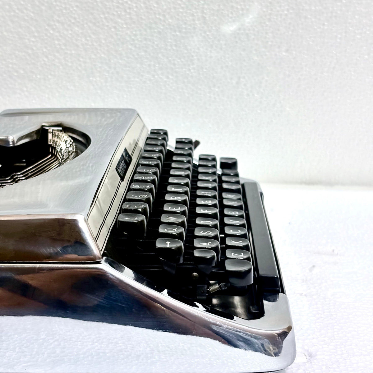 Mirror chrome Brother 210 manual typewriter with vintage mechanical design from RR Typewriter Mart India