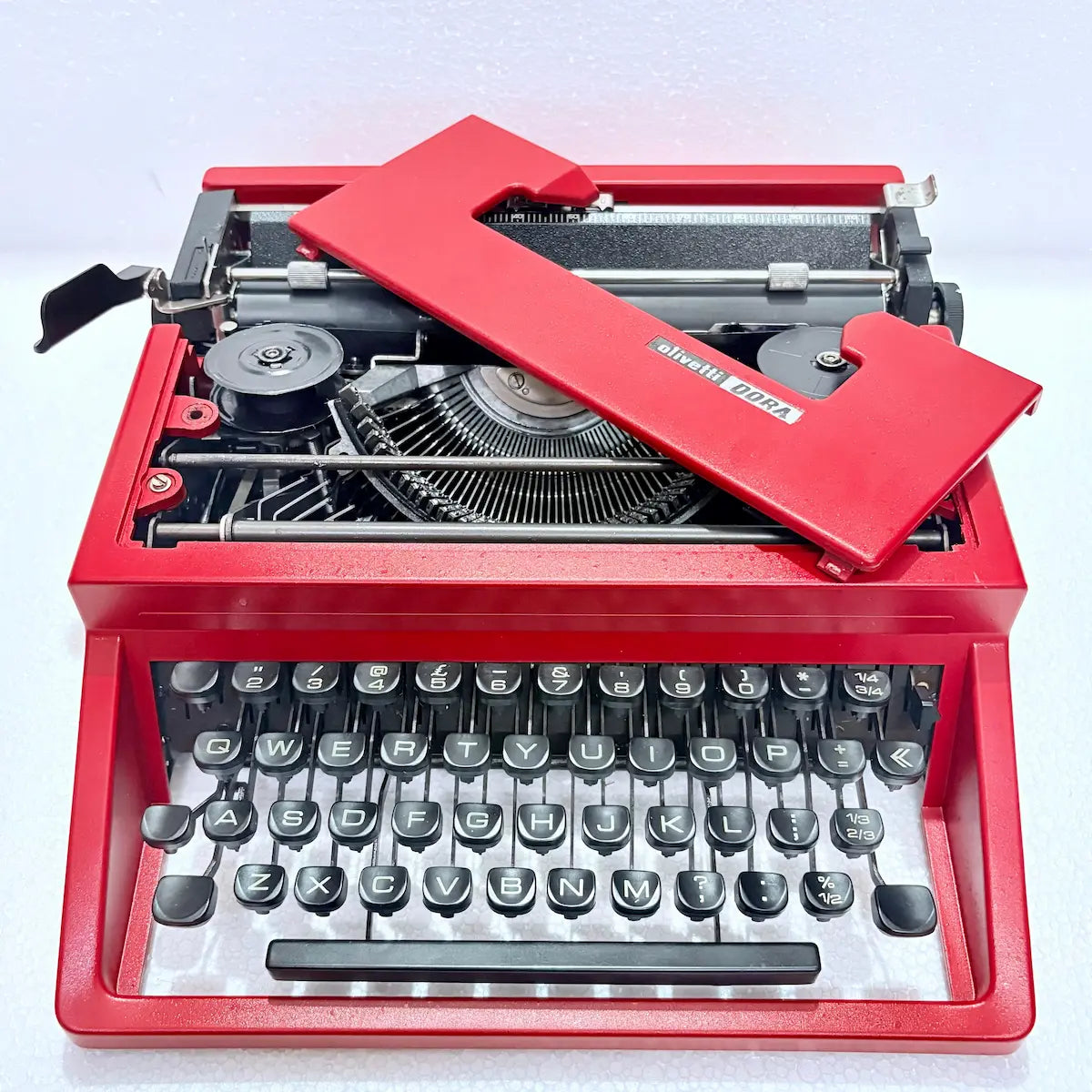 Red Olivetti Dora manual typewriter, classic Italian vintage typing machine, RR Typewriter Mart Delhi India online