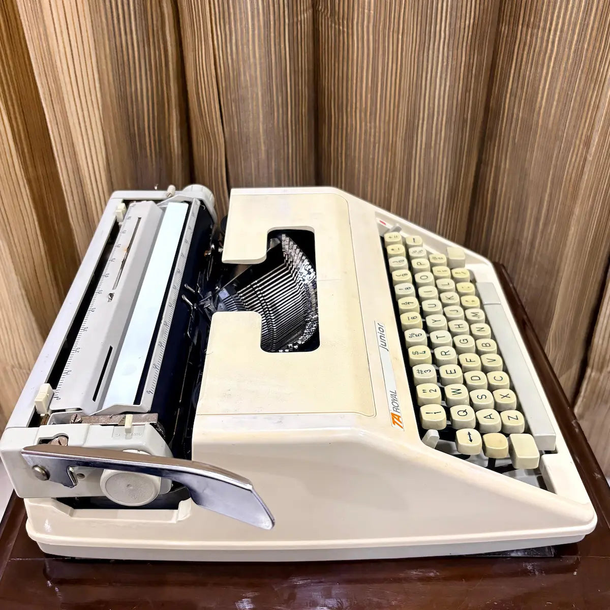 Royal Junior portable typewriter side angle showing carriage, platen and compact design, from RR Typewriter Mart.