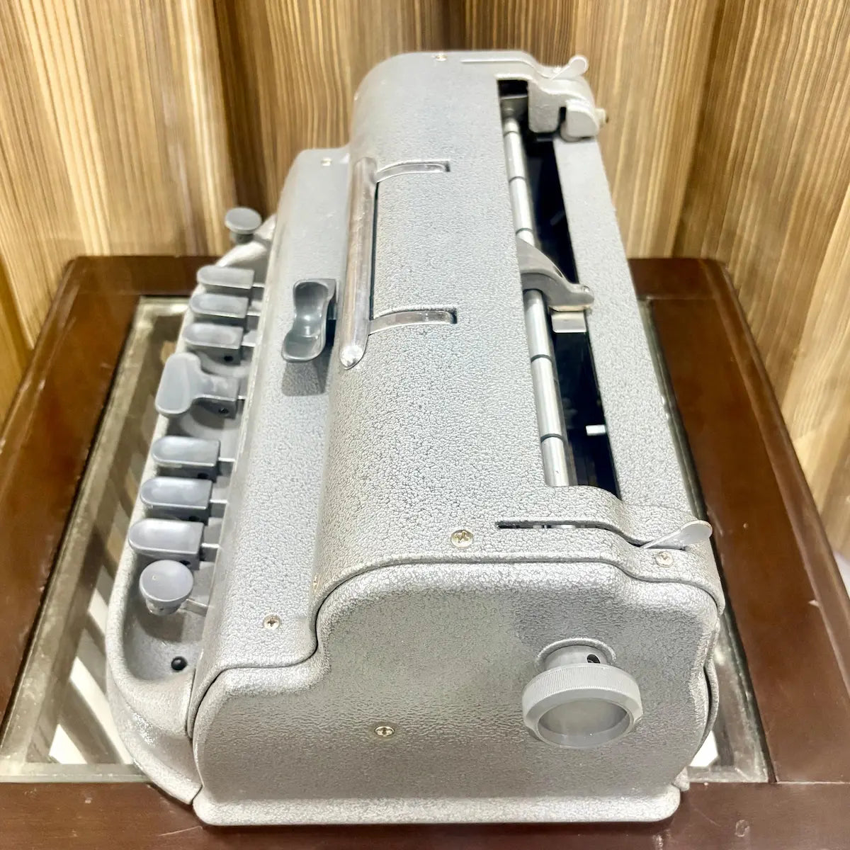Straight on view of the Perkins Braille Typewriter showing original grey finish and front key layout at RR Typewriter Mart in India.