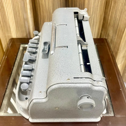 Straight on view of the Perkins Braille Typewriter showing original grey finish and front key layout at RR Typewriter Mart in India.