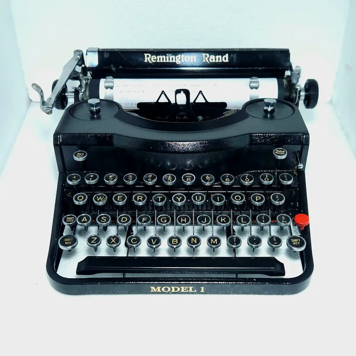 Remington Noiseless Model 1 black manual typewriter angled view with round keys, rare American vintage typing machine