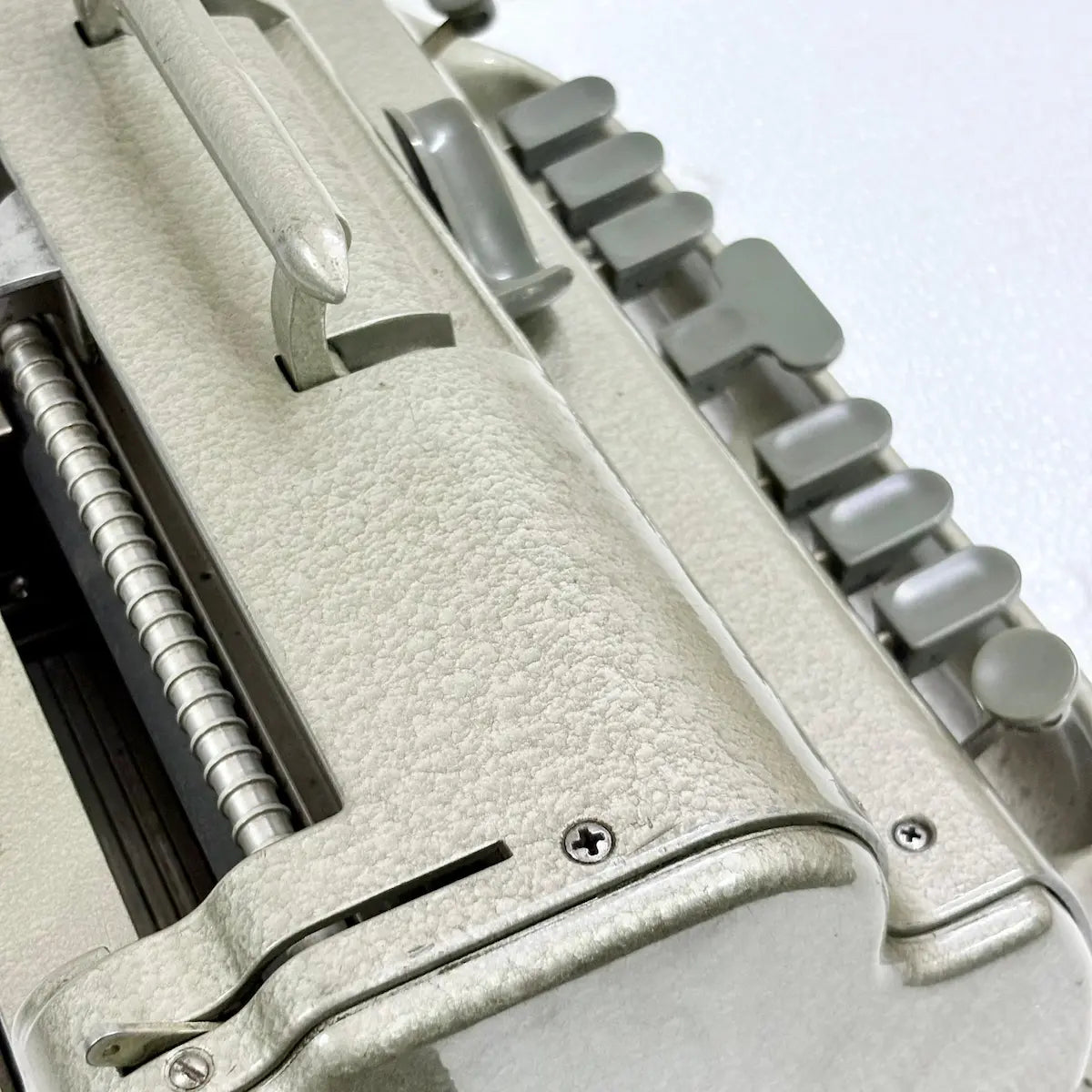 American-imported Perkins Typewriter for Braille writing, featuring a distinctive gold-like finish and strong metal construction from RR Typewriter Mart