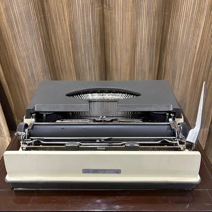 Kovac manual English typewriter in mint unused condition, featuring a factory original two tone grey and white finish | RR Typewriter Mart
