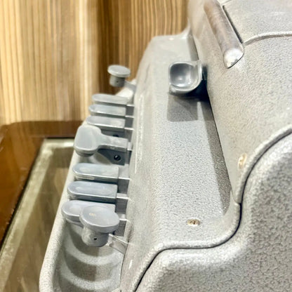 Side detail of the Perkins Braille Typewriter showing tactile keys, textured factory paint and metal casing at RR Typewriter Mart India.