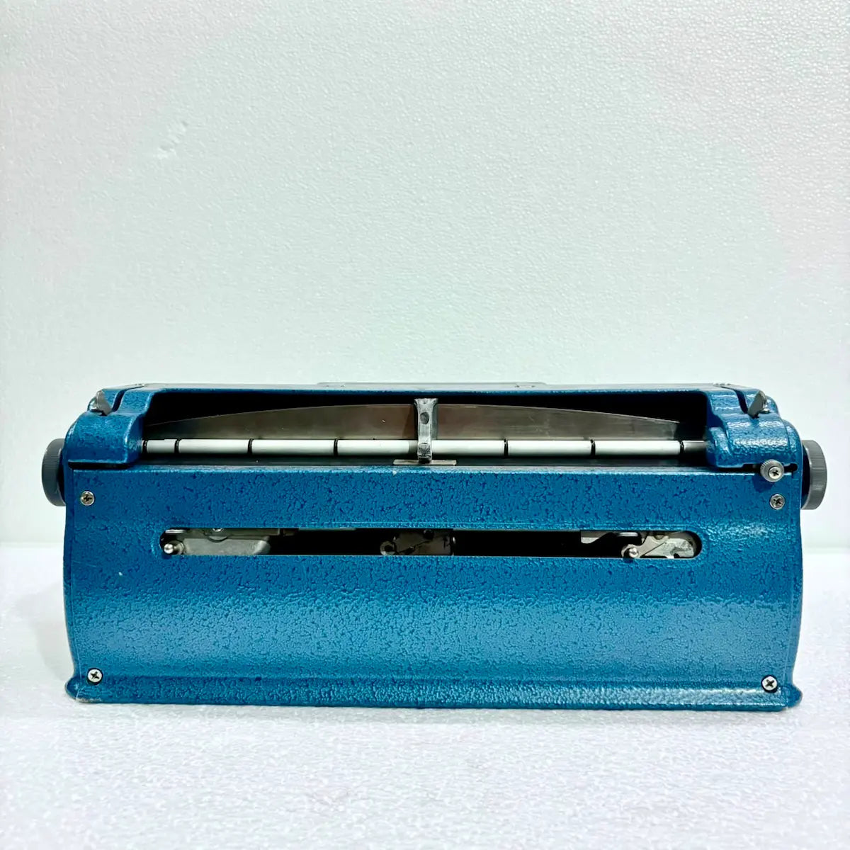 Rear view of Perkins Braille Typewriter showing roller and carriage mechanism, an imported Perkins Brailler from RR Typewriter Mart.
