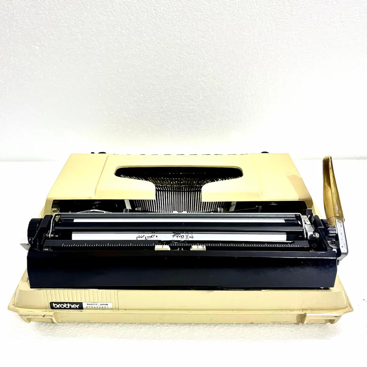 Brother 750TR Arabic typewriter close-up featuring genuine Arabic characters, black keyboard and cream vintage casing for collectors