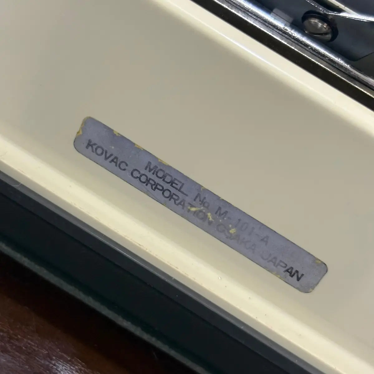 Vintage Japanese Kovac typewriter with a cream keyboard and grey body, preserved for collectors of classic writing machines | RR Typewriter Mart