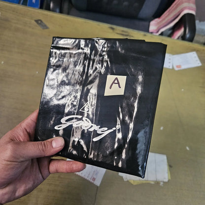Hand holding folded foolscap typewriter rexine dust cover for manual typewriter protection and maintenance storage
