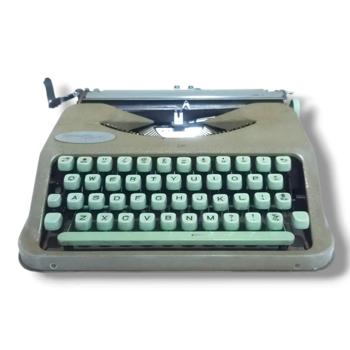 Hermes Baby Rocket portable typewriter low front view showing mint green English keyboard and compact Swiss body