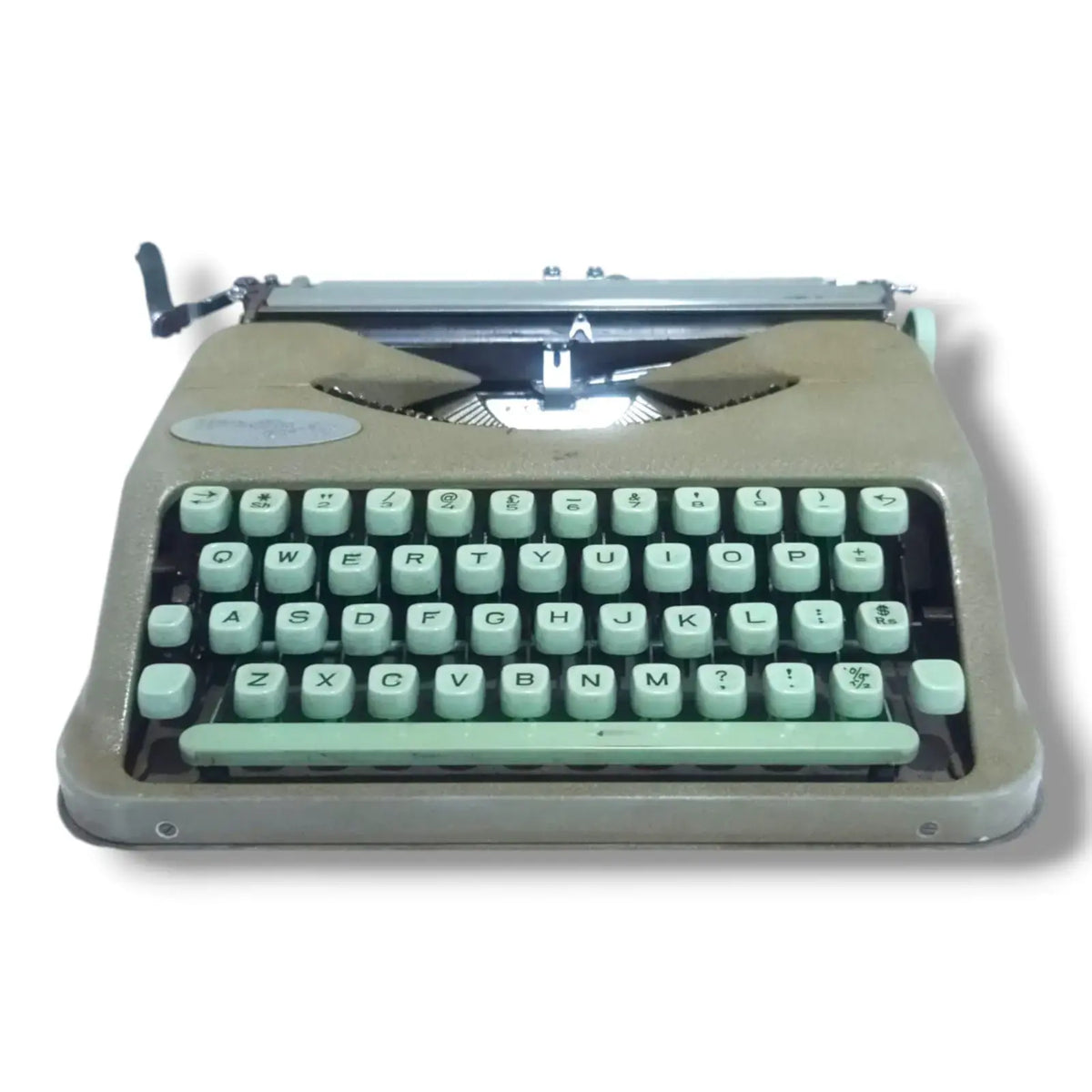 Hermes Baby Rocket portable typewriter low front view showing mint green English keyboard and compact Swiss body