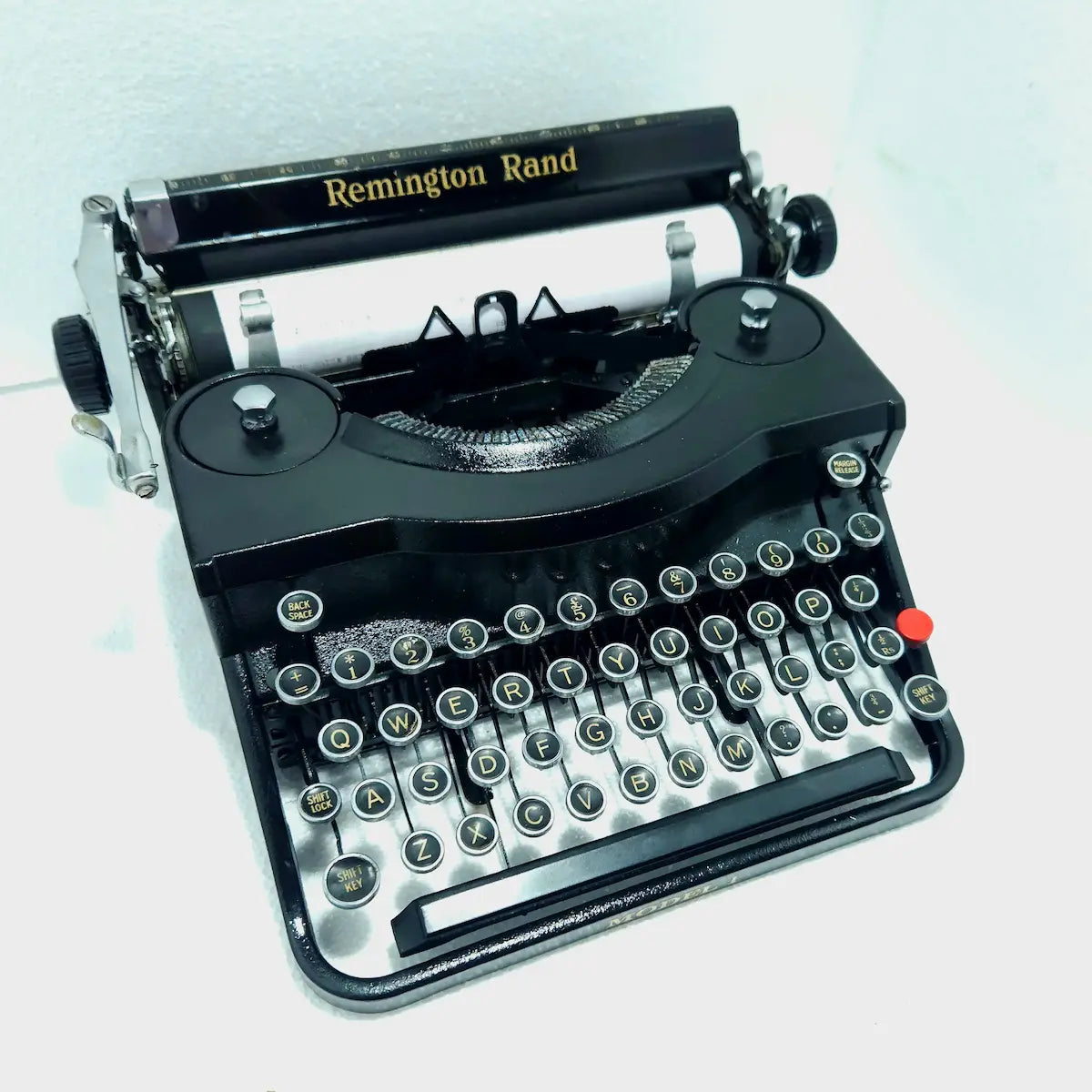 Remington Noiseless Model 1 vintage typewriter angled front view with Royal Black finish and round manual typing keys