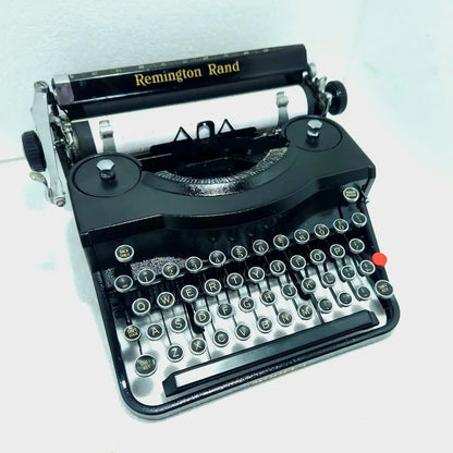 Remington Noiseless Model 1 vintage typewriter angled front view with Royal Black finish and round manual typing keys