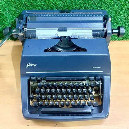 Godrej Prima Punjabi Typewriter with Gurmukhi keyboard, grey Foolscap typing machine on tabletop