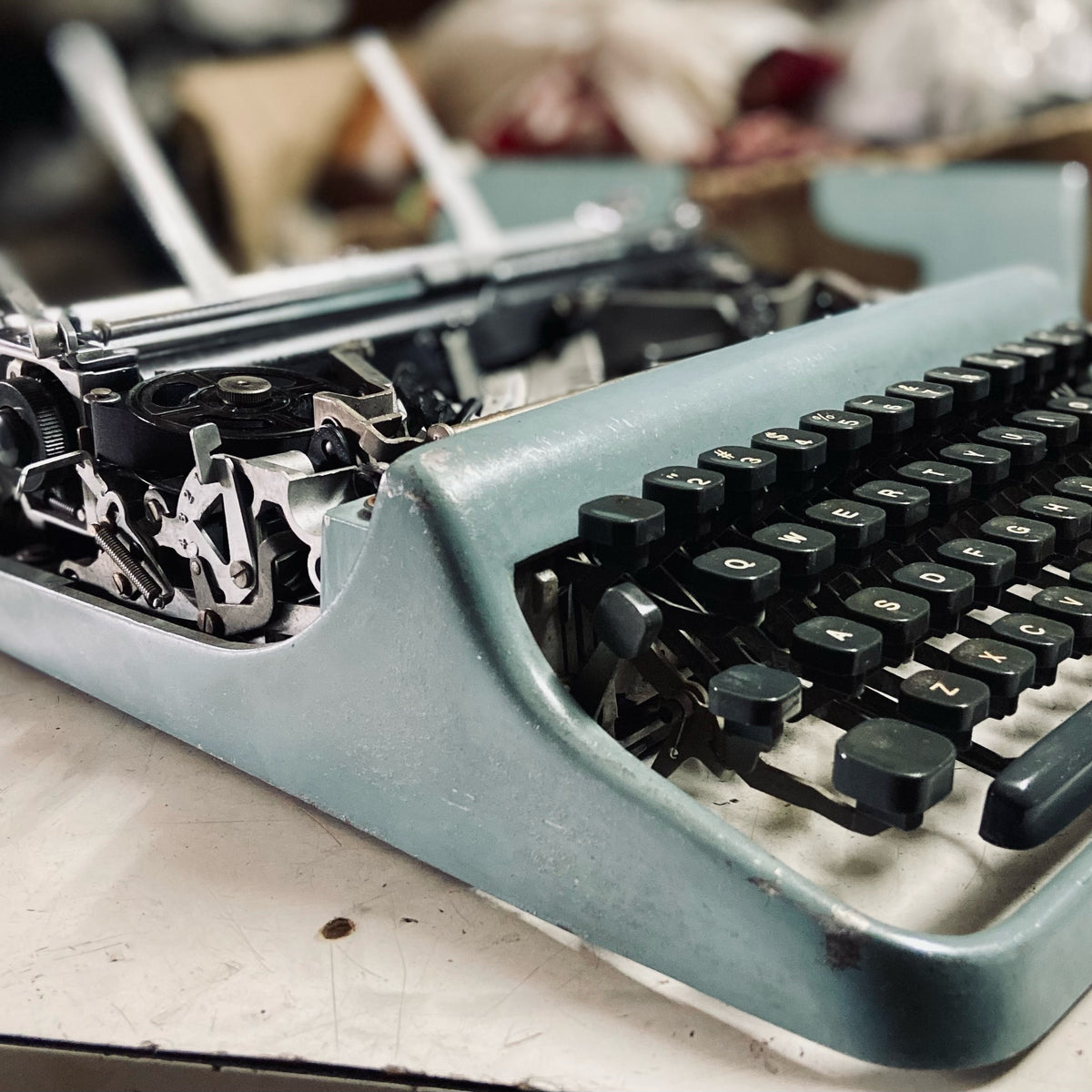 Left side view of Original Olivetti Lettera 22 Portable Typewriter by RR Typewriter Mart, imported typewriter