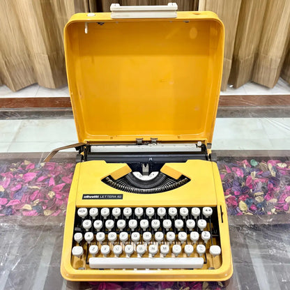 Olivetti Lettera 82 yellow typewriter with open case and white keys, vintage portable typewriter at RR Typewriter Mart