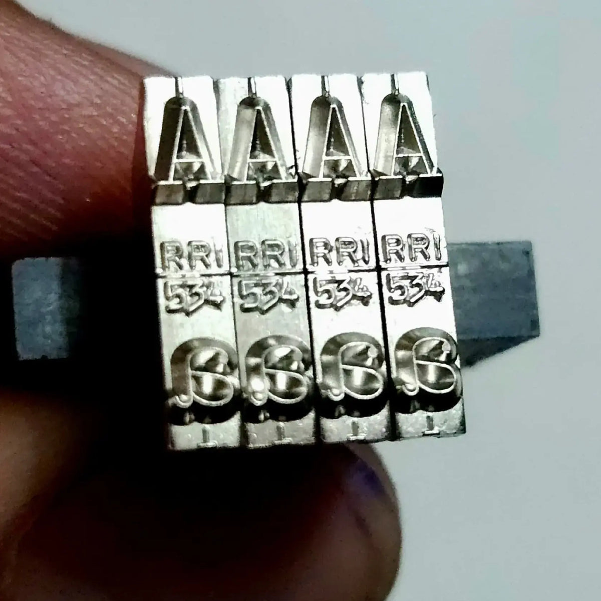 Close-up of English Long Motion Typeface A type slug for restoring crisp typewriter impressions and character clarity