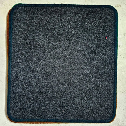 Grey manual typewriter table mat with rounded corners and thick finish for typing machine care and support