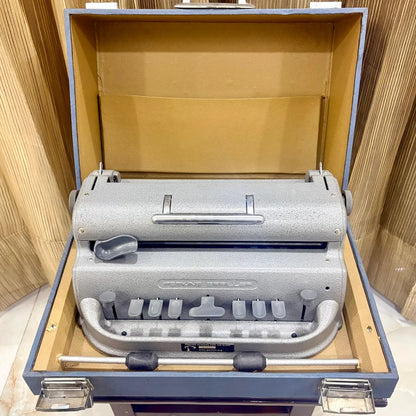Mint grey Perkins Braille Typewriter in original factory finish displayed with its wooden carrying case at RR Typewriter Mart India.