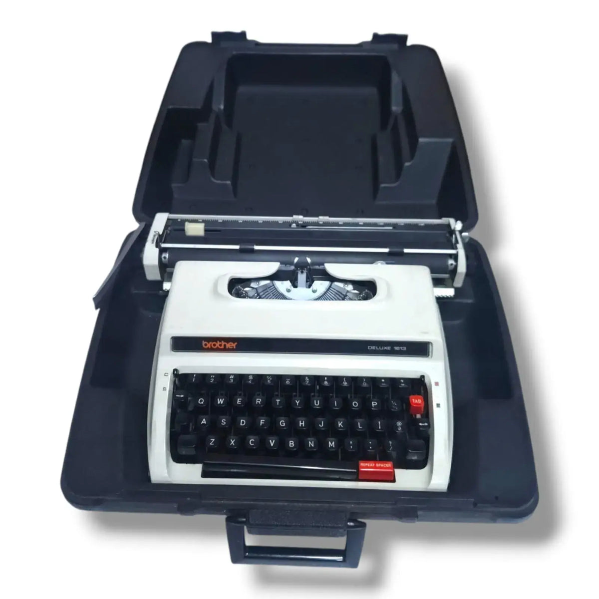 Brother Deluxe typewriter with carry case, portable imported typing machine from typewriter store