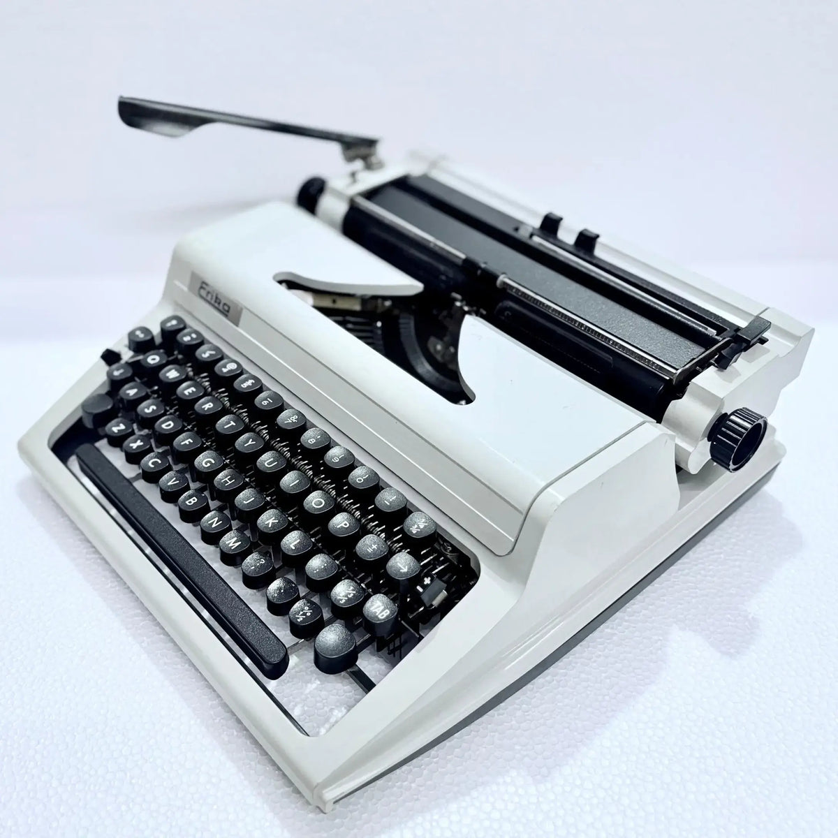 Angled view of Erika Typewriter showing keys, displayed by RR Typewriter Mart as a manual typewriter