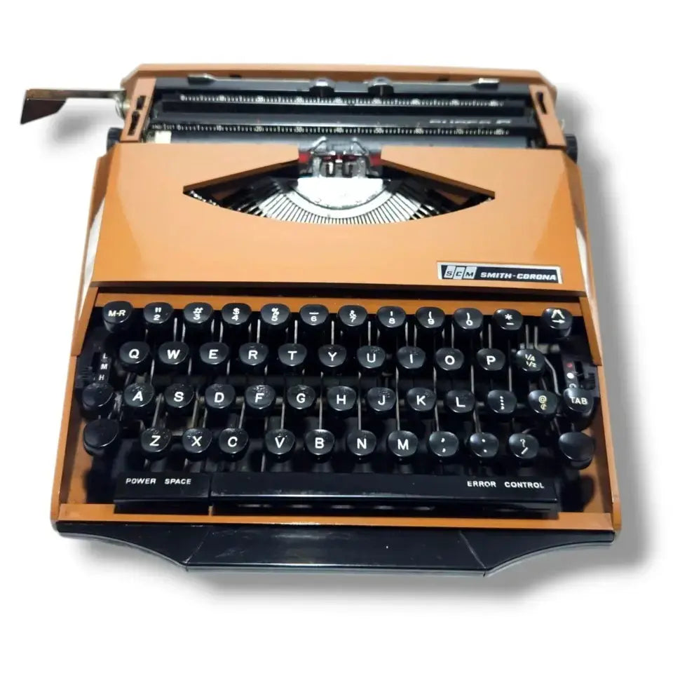 Buy Smith Corona typing machine with bold orange body from trusted typewriter shop RR Typewriter Mart