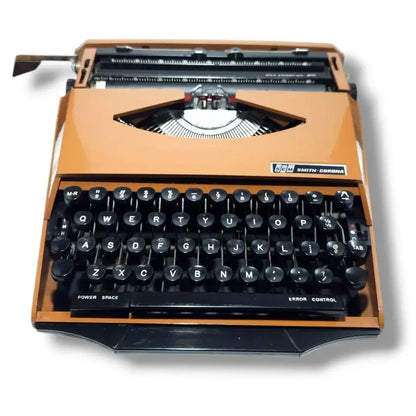 Buy Smith Corona typing machine with bold orange body from trusted typewriter shop RR Typewriter Mart