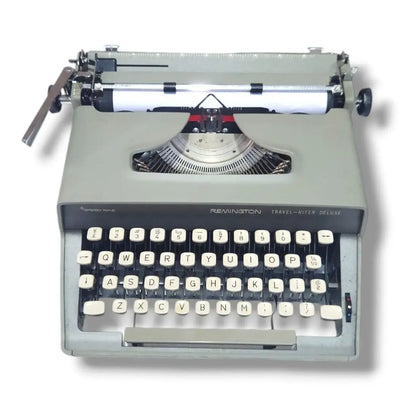 Remington Travel-Writer Deluxe portable typewriter, front view with English keyboard and classic two-tone body