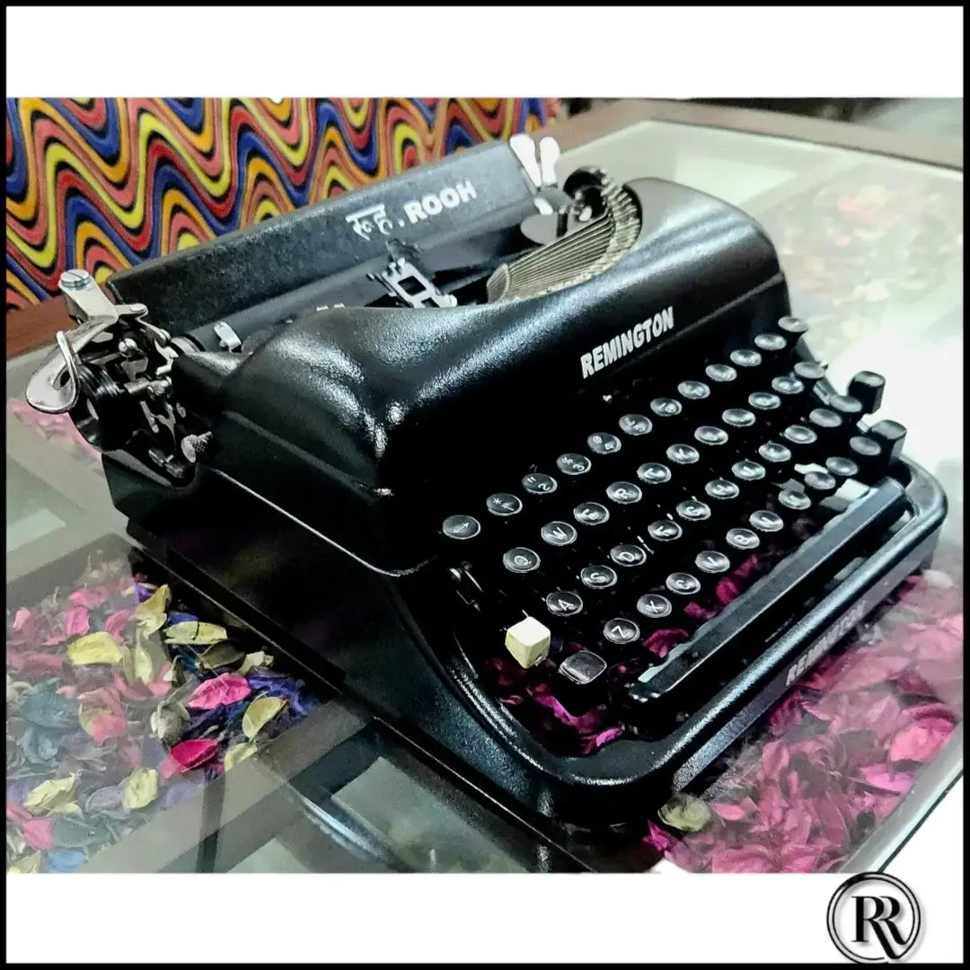 Angled view of Remington Rand Deluxe Portable Typewriter, imported American typing machine for writers